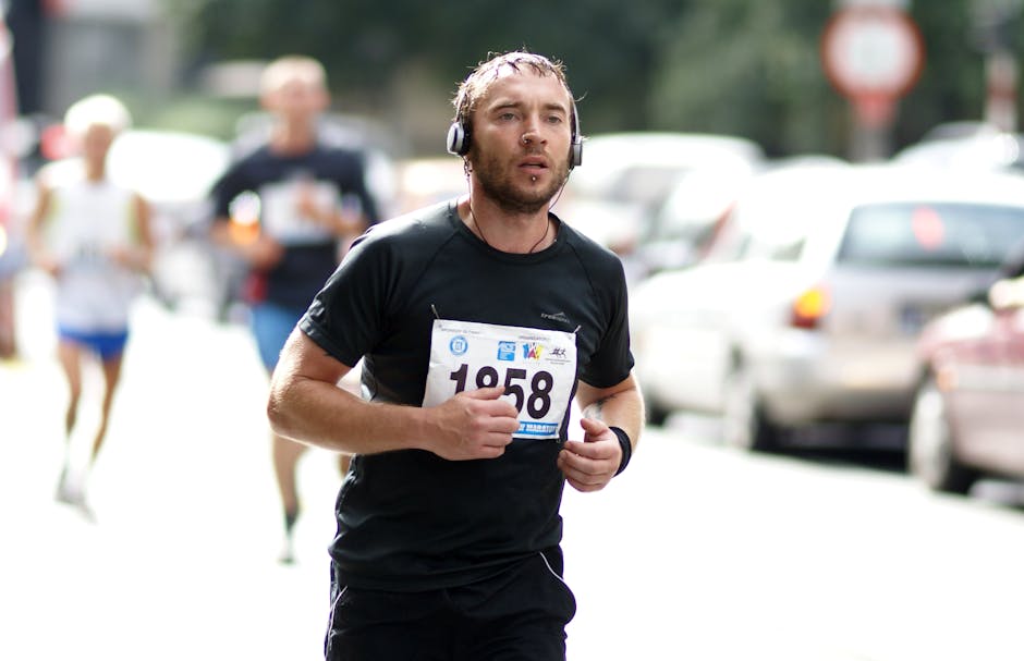 A focused male runner, wearing